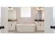 Luxurious bathroom with double vanities and soaking tub at 2286 Cadenza Cir, Dacula, GA 30019