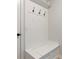 Mud room with coat hooks and storage bench at 2286 Cadenza Cir, Dacula, GA 30019
