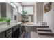 Elegant bathroom features a soaking tub, vanity with basin sink and modern fixtures at 3266 Bruckner Blvd, Snellville, GA 30078