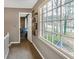 Hallway featuring natural light, decorative shelving, and views of the neighborhood street at 3266 Bruckner Blvd, Snellville, GA 30078