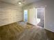 Modern bedroom showcasing an accent wall and sliding door to the ensuite bathroom at 560 Dutch Valley Ne Rd # 2301, Atlanta, GA 30324
