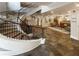 Elegant curved staircase and reception area featuring slate tile floors and comfortable seating at 560 Dutch Valley Ne Rd # 2301, Atlanta, GA 30324