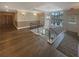 Bright hallway featuring hardwood floors, staircase with iron spindles, and large windows at 560 Dutch Valley Ne Rd # 2301, Atlanta, GA 30324