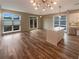 Open-concept living space with large windows, modern lighting, and a kitchen island at 560 Dutch Valley Ne Rd # 2301, Atlanta, GA 30324