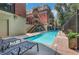 Bright swimming pool surrounded by lounge chairs and apartments, offering a relaxing outdoor space at 560 Dutch Valley Ne Rd # 2301, Atlanta, GA 30324