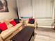Comfortable living room with a neutral sofa, chair, and natural light from the window at 20 Nw Marietta St # 8D, Atlanta, GA 30303