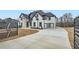 Elegant two-story home featuring a gated entry, modern design and three car garage at 928 Flanagan Mill Rd, Auburn, GA 30011