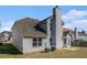 Back of the home showing a vinyl siding and grassy area at 11643 Sarah Loop, Hampton, GA 30228