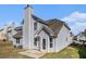 Exterior view of home, featuring light gray siding and a well-maintained yard at 11643 Sarah Loop, Hampton, GA 30228