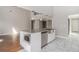 Kitchen island with granite countertop, undermount sink, stainless steel appliances, and ample storage at 11643 Sarah Loop, Hampton, GA 30228