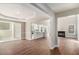 Open concept living area featuring a fireplace, kitchen island, and modern finishes at 11643 Sarah Loop, Hampton, GA 30228