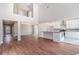 Bright open-concept floor plan with kitchen island and vaulted ceilings at 11643 Sarah Loop, Hampton, GA 30228