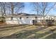 View of the backyard showcasing the deck and the home's architecture at 1414 Pierce Se Ave, Smyrna, GA 30080