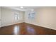 Bedroom with hardwood floors, two windows, and a ceiling light at 1414 Pierce Se Ave, Smyrna, GA 30080