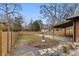 Expansive backyard featuring wooden fencing, gravel areas, a patio, and mature trees for privacy and shade at 1742 Ridgeway Nw Ave, Atlanta, GA 30318