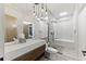 Spa-like bathroom featuring a modern vanity, illuminated mirror, and luxurious walk-in shower with a soaking tub at 1742 Ridgeway Nw Ave, Atlanta, GA 30318