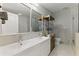 Modern bathroom featuring a double sink vanity, glass shower, and stylish shelving at 1742 Ridgeway Nw Ave, Atlanta, GA 30318