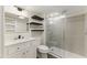 Bathroom featuring floating shelves, a vanity, and a glass-enclosed shower at 1742 Ridgeway Nw Ave, Atlanta, GA 30318