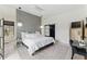 Bright bedroom with modern lighting fixtures and grey accent wall at 1742 Ridgeway Nw Ave, Atlanta, GA 30318