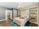Comfortable bedroom with built-in shelving, wood floors, and ensuite bathroom at 1742 Ridgeway Nw Ave, Atlanta, GA 30318