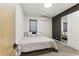 A bright bedroom featuring a large bed, ample closet space, and dark-toned accent wall at 1742 Ridgeway Nw Ave, Atlanta, GA 30318