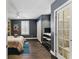 Stylish bedroom featuring wood floors, a ceiling fan, and plenty of natural light at 1742 Ridgeway Nw Ave, Atlanta, GA 30318