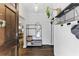 Inviting entryway with wood floors, a modern mirror, coat rack, and view into the living spaces, adding functionality at 1742 Ridgeway Nw Ave, Atlanta, GA 30318