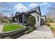 Side view of the home showing a well-maintained yard and access to the porch at 1742 Ridgeway Nw Ave, Atlanta, GA 30318