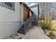 Exterior view of side yard with stairs leading to a modern addition at 1742 Ridgeway Nw Ave, Atlanta, GA 30318