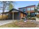 Modern home with wood and gray siding, plus a carport and outdoor dining space on the back of the house at 1742 Ridgeway Nw Ave, Atlanta, GA 30318