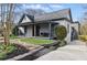 Charming home with a covered front porch, stone walkway, and well-maintained landscaping, offering great curb appeal at 1742 Ridgeway Nw Ave, Atlanta, GA 30318