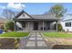 Charming gray cottage-style home with a welcoming front porch and manicured front yard at 1742 Ridgeway Nw Ave, Atlanta, GA 30318