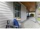 Relaxing front porch with stylish tile flooring, comfortable seating, and a wood paneled ceiling at 1742 Ridgeway Nw Ave, Atlanta, GA 30318