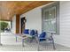 Charming front porch with comfortable seating and a decorative tiled floor at 1742 Ridgeway Nw Ave, Atlanta, GA 30318