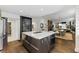 Open kitchen design with large island, built-in oven and view of dining and living area at 1742 Ridgeway Nw Ave, Atlanta, GA 30318