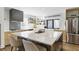 Bright, updated kitchen with a marble island and stainless steel refrigerator at 1742 Ridgeway Nw Ave, Atlanta, GA 30318