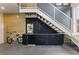 A modern staircase and sleek built-in cabinets accentuate the contemporary design of this living space at 1742 Ridgeway Nw Ave, Atlanta, GA 30318