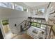 Open concept living room with floor to ceiling windows and modern railing at 1742 Ridgeway Nw Ave, Atlanta, GA 30318