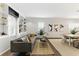 Bright living room featuring built-in shelving, a comfortable sofa, and dining area, perfect for relaxation and entertaining at 1742 Ridgeway Nw Ave, Atlanta, GA 30318