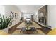 Open-concept space with shiplap walls, fireplace, dining table, and view into the kitchen creates a welcoming atmosphere at 1742 Ridgeway Nw Ave, Atlanta, GA 30318
