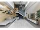 Spacious living room featuring modern decor, an open staircase, and designer lighting at 1742 Ridgeway Nw Ave, Atlanta, GA 30318