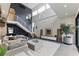 Bright and airy living room with modern staircase, neutral decor and high ceilings at 1742 Ridgeway Nw Ave, Atlanta, GA 30318