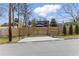 Home exterior behind wooden fence with caution sign; speed limit 25, children at play at 1742 Ridgeway Nw Ave, Atlanta, GA 30318
