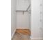 Walk in closet with shelving and wooden floor at 87 Peachtree Sw St # 204, Atlanta, GA 30303