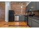 Kitchen featuring stainless steel appliances, granite countertops, and dark cabinets at 87 Peachtree Sw St # 204, Atlanta, GA 30303