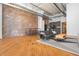 Spacious apartment featuring a large living area, modern kitchen, and exposed brick wall at 87 Peachtree Sw St # 204, Atlanta, GA 30303