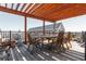 Outdoor rooftop deck featuring wooden pergola, dining table, and city views at 87 Peachtree Sw St # 204, Atlanta, GA 30303