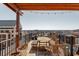 Charming rooftop deck with wooden pergola, string lights, and outdoor dining area, perfect for entertaining at 87 Peachtree Sw St # 204, Atlanta, GA 30303