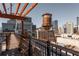 Unique rooftop deck featuring water tower, city views, and a relaxing outdoor seating area at 87 Peachtree Sw St # 204, Atlanta, GA 30303