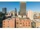 Rooftop view of a building with a classic water tower set against the backdrop of the city skyline at 87 Peachtree Sw St # 204, Atlanta, GA 30303